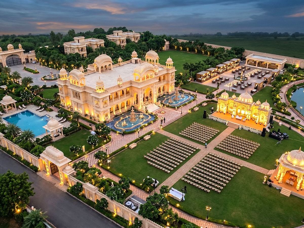 Aerial view of a garden wedding venue with lawn seating and a lake